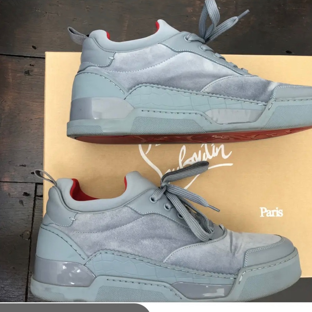 Iconic icy blue grey suede Aurelian Sneakers from Christian Louboutin.